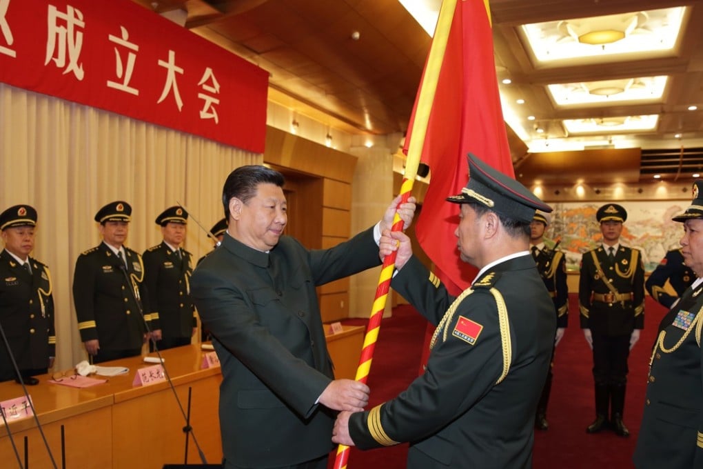 Chinese President Xi Jinping (left, front) confers a military flag to Commander Song Puxuan and Political Commissar Chu Yimin of the Northern Theatre Command on Monday. Photo: Xinhua