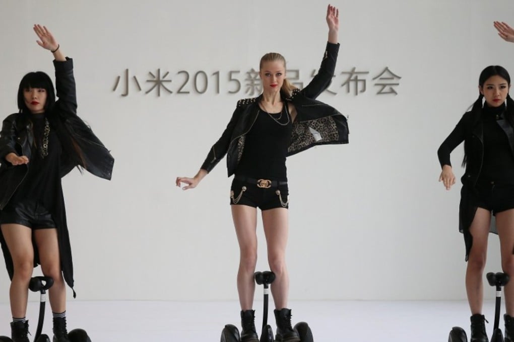 Models ride Xiaomi Ninebot electric self-balancing scooters in this 2015 file photo. Qiming Venture Partners was an early stage partner in tech start-up Xiaomi, which became famous for its smartphones but is now building a catalogue of smart products. Over 50 per cent of Qiming’s transactions involve early-stage companies. Photo: EPA