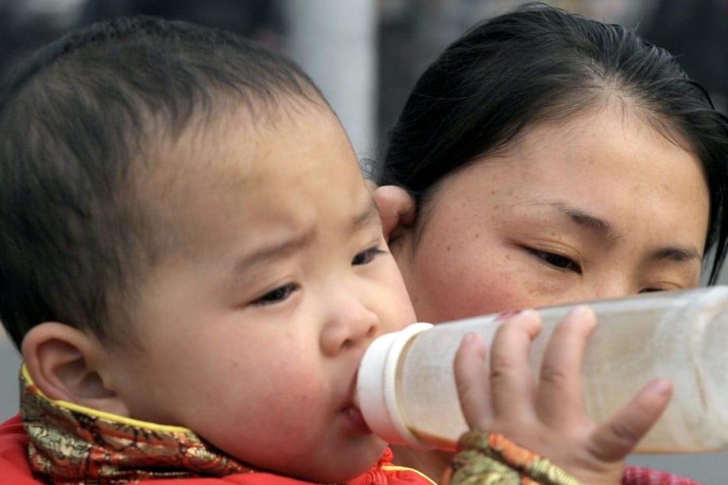 A Chinese child drinks from a formula milk bottle. A major study in The Lancet leaves no doubt that breastfeeding is better for babies, and that China could do more to promote breastfeeding. Photo: AFP