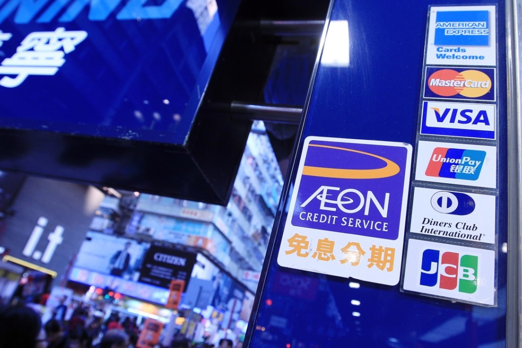 Credit card signs on display at a shop in Mong Kok. Photo: Jonathan Wong