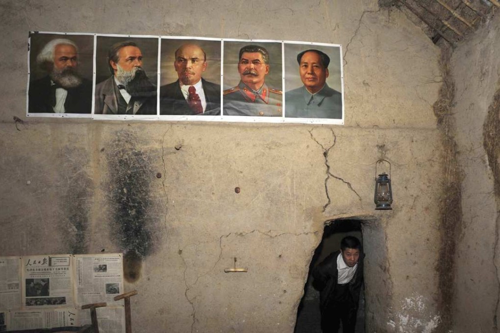 An old house in Xiaogang village in Anhui province with portraits of Marx, Engels, Lenin, Stalin and Mao on the wall. In 1978, a group of Xiaogang villagers decided to entrust publicly owned farmlands to individual households, marking the start of China’s economic reforms. Photo: Reuters