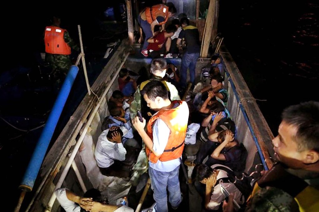 Authorities detain a group of South Asians trying to enter Hong Kong illegally in July, 2015