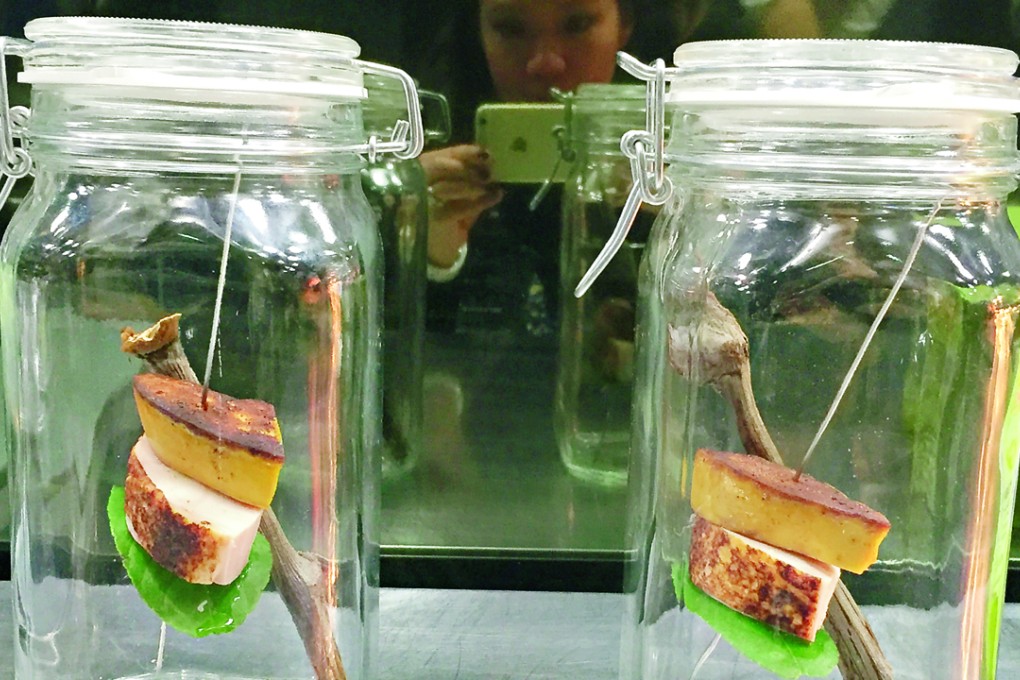 Chicken in a jar served beneath a slice of smoked foie gras at Paul Pairet’s Ultraviolet in Shanghai. Photos: Juliana Loh