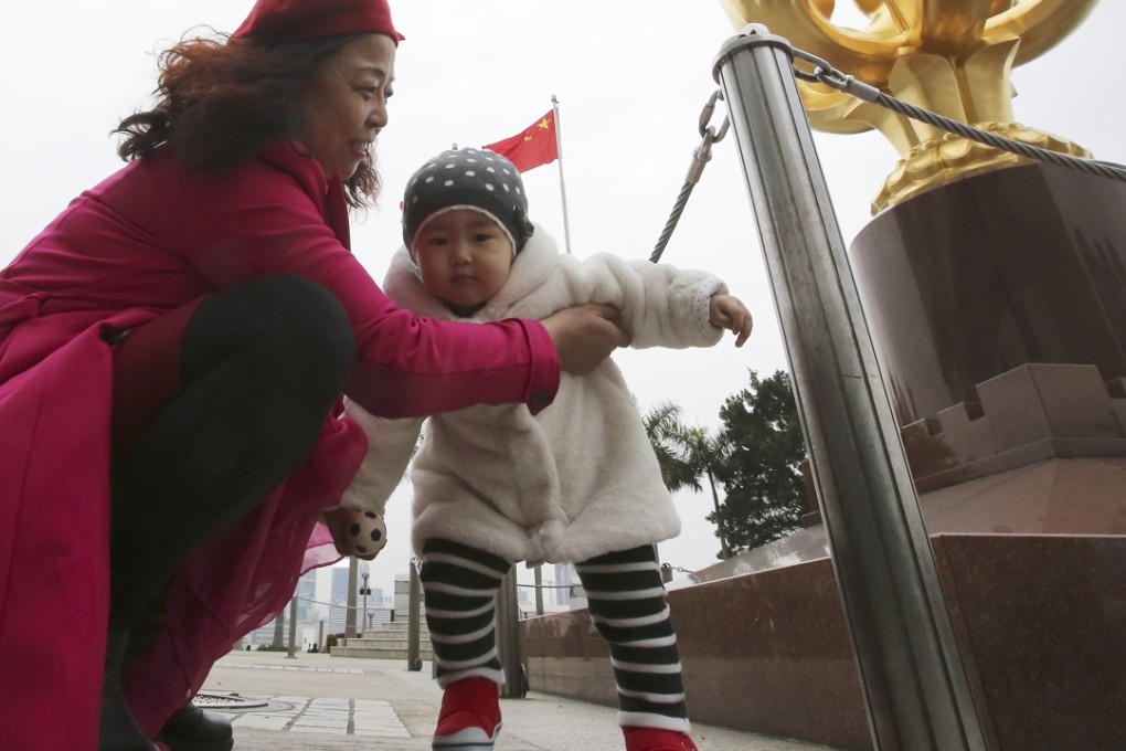 Mainland tourists at Golden Bauhinia Square, Wan Chai. Photo: Edward Wong