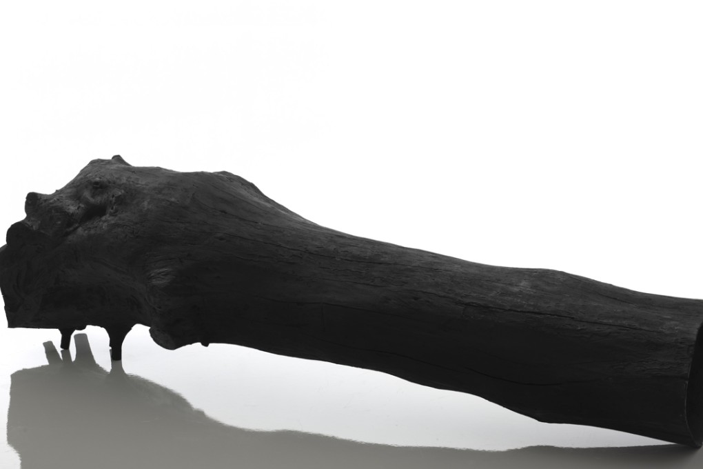 Designer Verter Turroni’s black fibreglass Olmo bench modelled on a fallen tree, creating the effect of a piece of charcoal, at Maison & Objet 2016. Photo: Laboratorio dell’lmperfetto