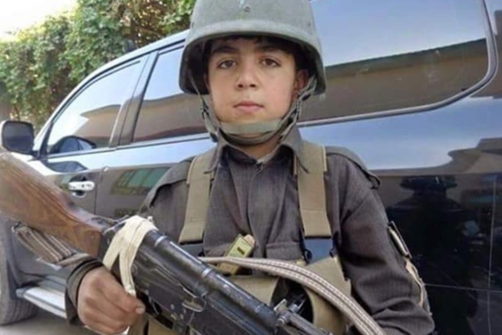 Wasil Ahmad wields an AK-47 assault rifle in this picture shared via social media. Photo: Twitter