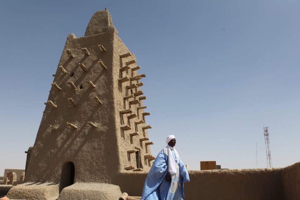 A man stands in front of the Djingareyber mosque in Timbuktu, central Mali, on Thursday. Photo: AFP