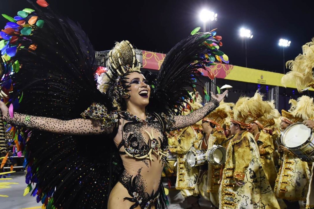 Revellers from the Unidos de Vila Maria samba school perform during the first night of Carnival in Sao Paulo. Photo: AFP