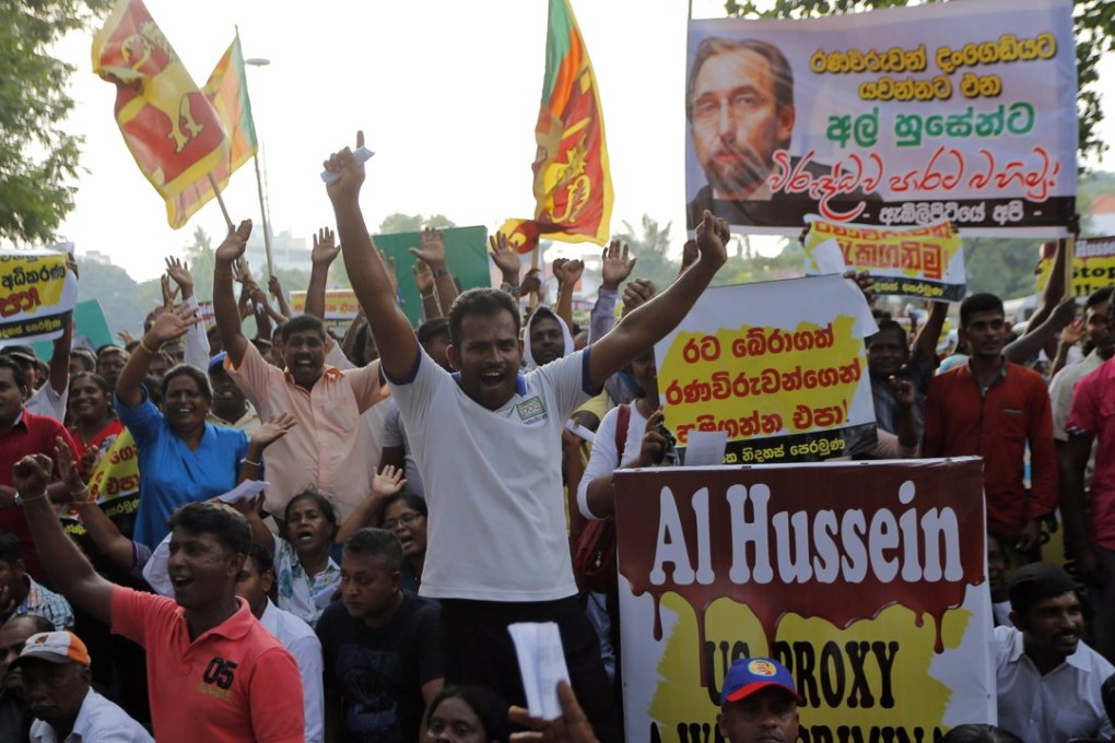 Hundreds of supporters of the Sri Lankan opposition political parties protest outside the UN office in Colombo. They criticised a report by United Nations human rights chief Zeid Raad al-Hussein as he began discussions with the Sri Lankan government on measures taken to investigate alleged atrocities committed during the long civil war. Photo: AP