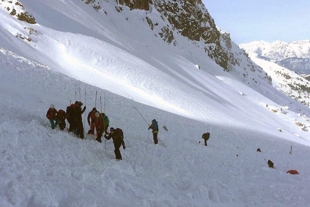 Rescue teams search for people buried by an avalanche at the Wattener Lizum, Austria, on February 6. Photo: AFP