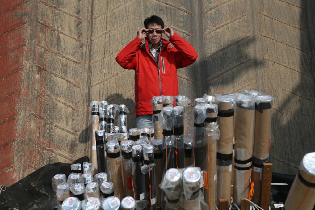Pyro Magic CEO Wilson Mao Wai-shing with a few of his toys. Photos: Sam Tsang