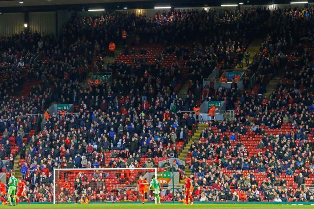 Liverpool fans leave the stands at the Kop end after 77 minutes' of play during the match against Sunderland. Photo: AFP