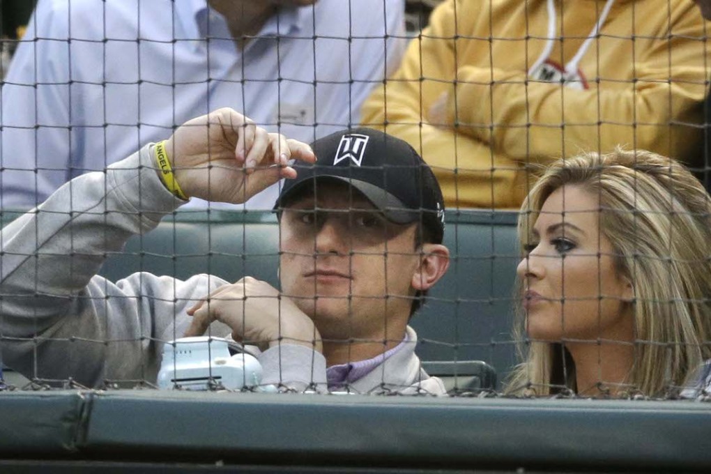Johnny Manziel with Colleen Crowley at a baseball game. Photo: AP