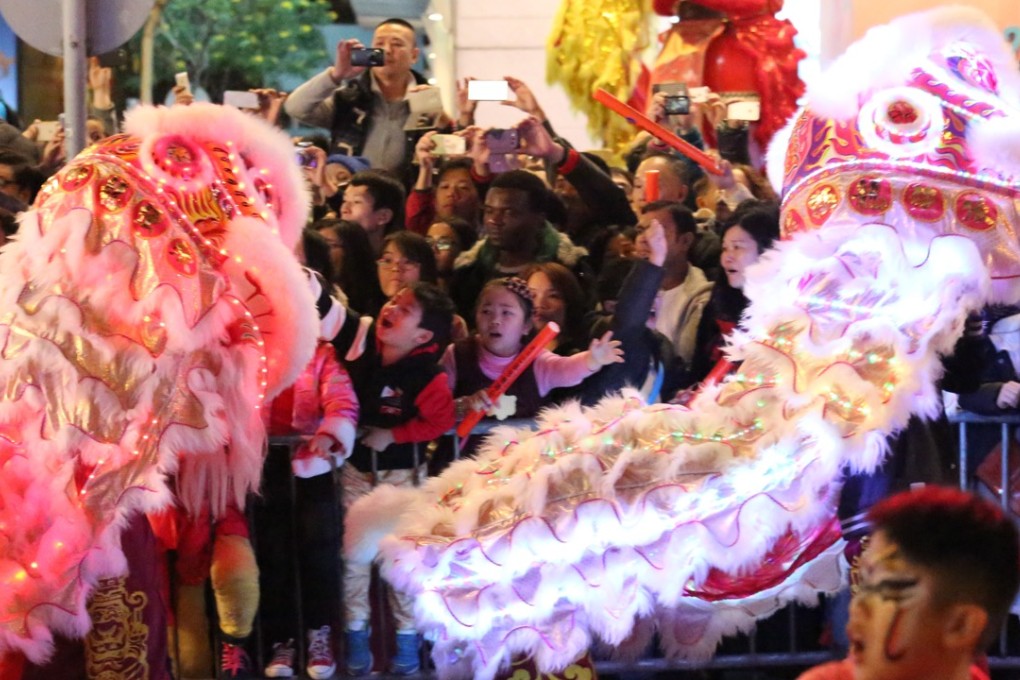 Traditional Chinese New Year lion dance meets new LED lights. Photos: Nora Tam