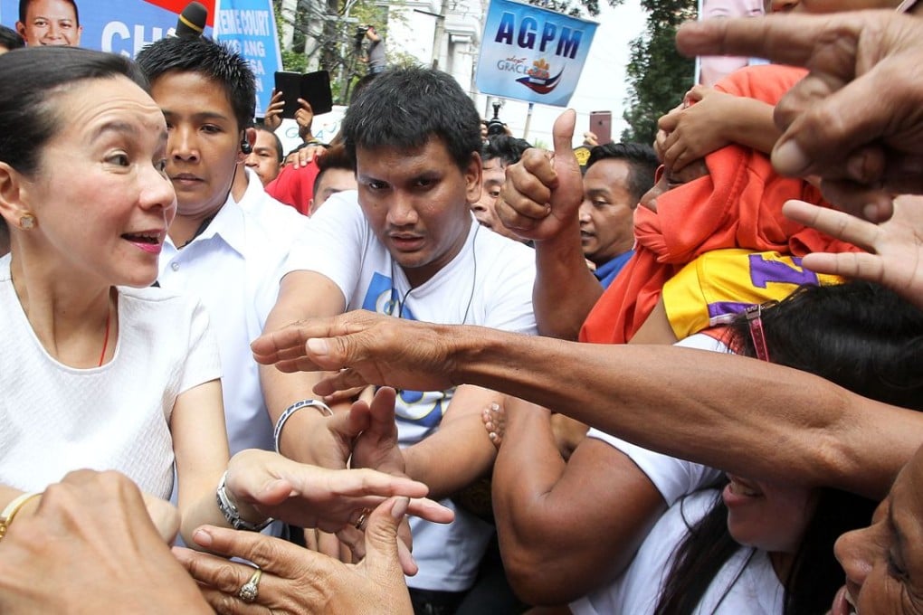 Senator Grace Poe greets supporters at the Philippine Supreme Court in Manila in January. The Supreme Court could knock her out of the race before the May 9 elections, with justices currently listening to arguments she is ineligible based on citizenship and residency laws. Photo: Xinhua