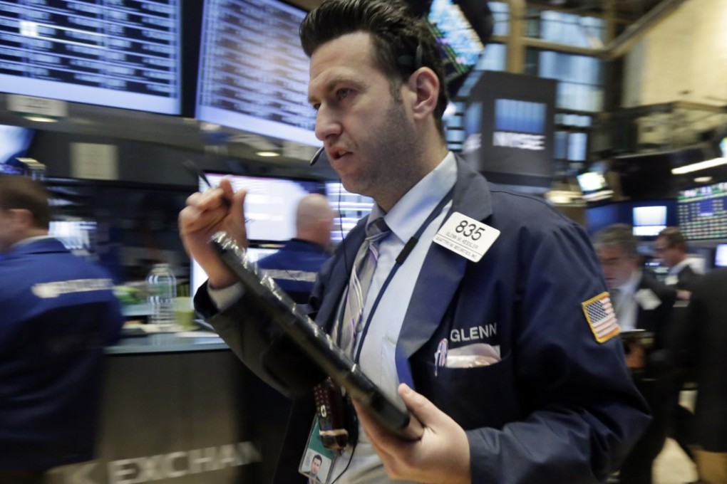Trader Glenn Kessler hurries across the floor of the New York Stock Exchange,as a broad sell-off hit equities with technology, financial and energy stocks taking the biggest hit. Photo: AP