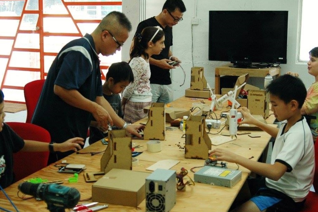 Kids get stuck in during a hands-on class at MakerBay. Photo: Handout
