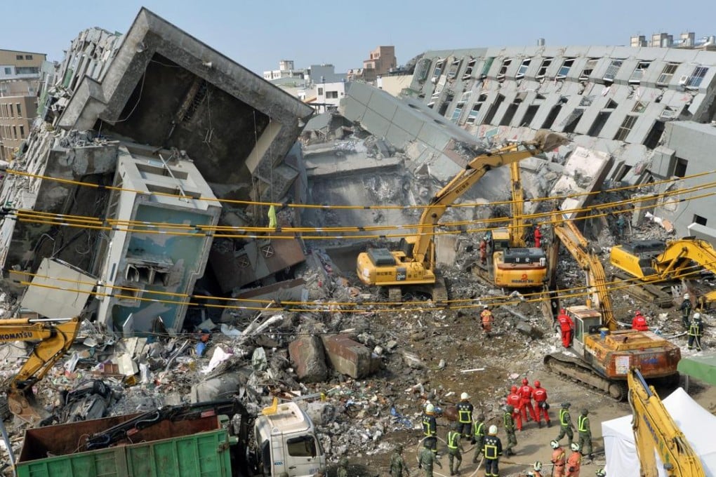 Rescue workers at the site of the collapsed building in Tainan. Photo: Kyodo