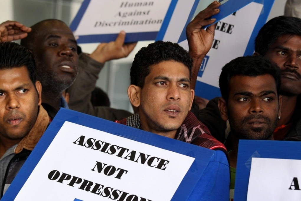 About 100 Asylum seekers and refugees appeal to Legislative Council Social Welfare panel over improvement in screening mechanism at Legco Complex, Tamar. 13JAN14