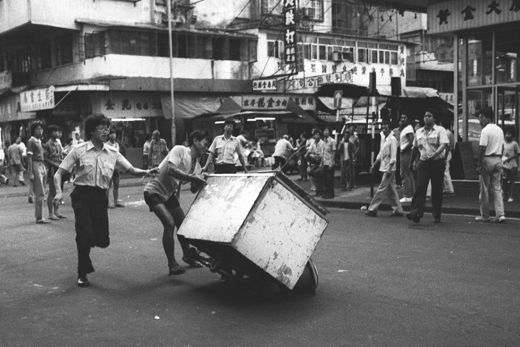 Battling officialdom is nothing new for cooked-food hawkers, like this one fleeing enforcement officers of the then Urban Service Department outside Golden Centre in Sham Shui Po. Photo: SCMP