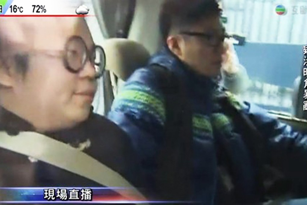 Scholarism member Derek Lam Shun-hin (left) seen being escorted by car from the airport. Image: TVB