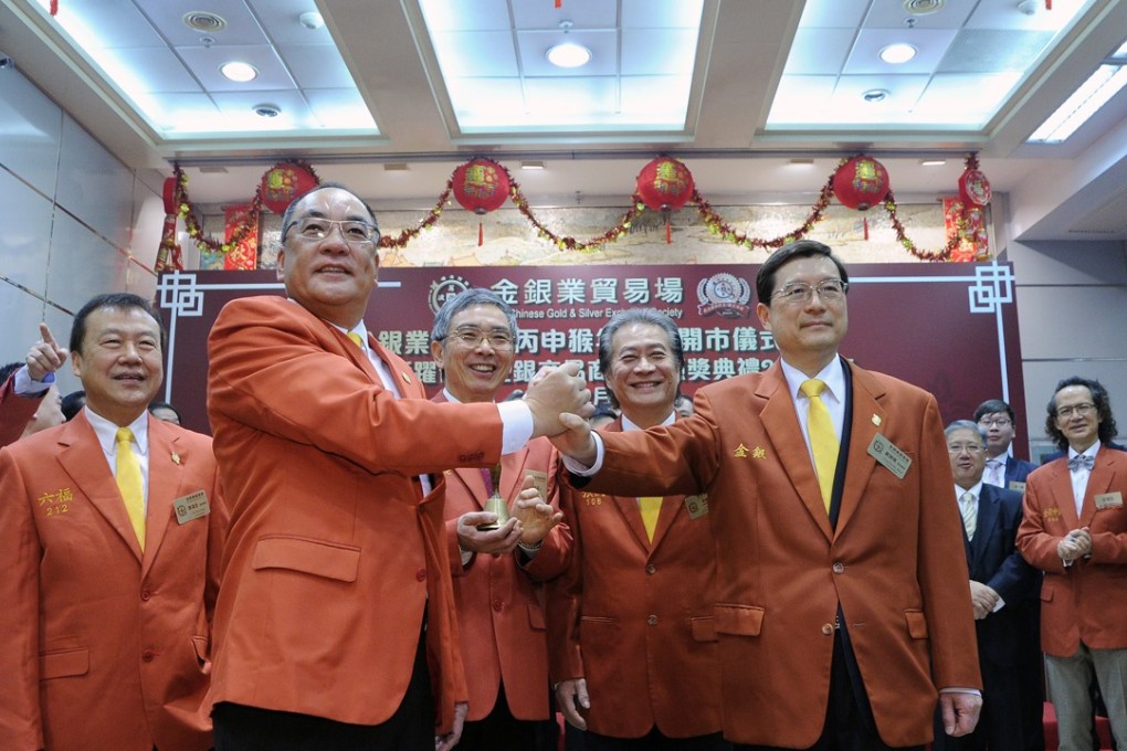 Chinese Gold and Silver Exchange Society president Steven Chan (second left) and vice-president Vincent Tse at the opening ceremony of the exchange’s first trading day of the Year of the Monkey. Photo: SCMP Picture