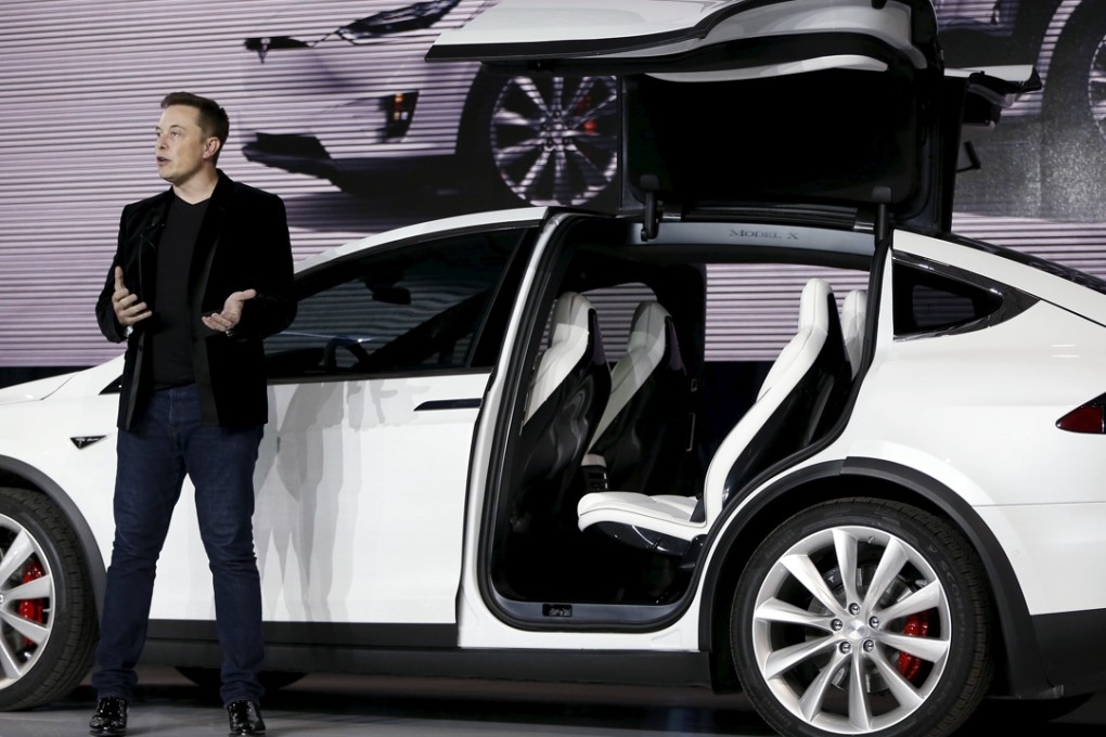 Tesla Motors CEO Elon Musk introduces the falcon wing door on the Model X electric sports-utility vehicles during a presentation in California in this September 2015 file photo. Photo: Reuters
