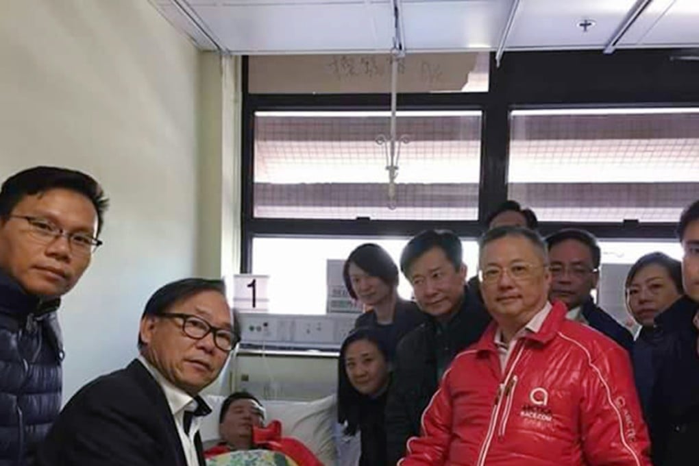 Elizabeth Quat (fourth from left) and nine pro-establishment lawmakers visit Sergeant Wong in hospital. Photo: SCMP Pictures