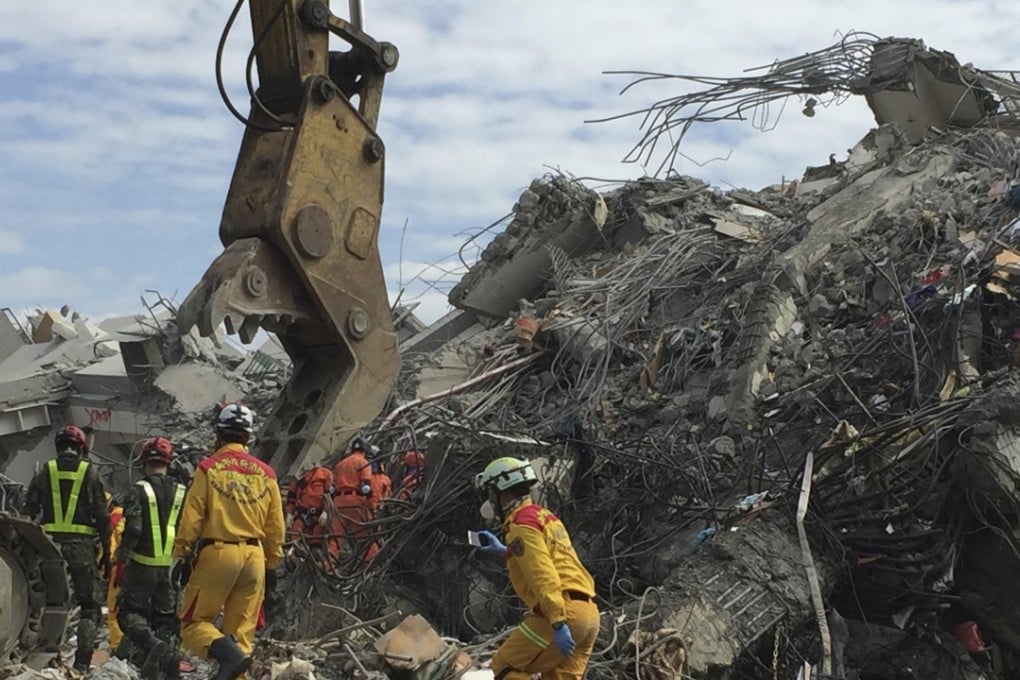 Rescue teams at the scene of the apartment block collapse in Tainan. Photo: AP