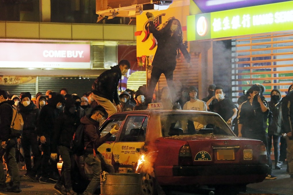 Rioters on the rampage in the streets of Mong Kok. The scale of violence shocked the city. Photo: AP