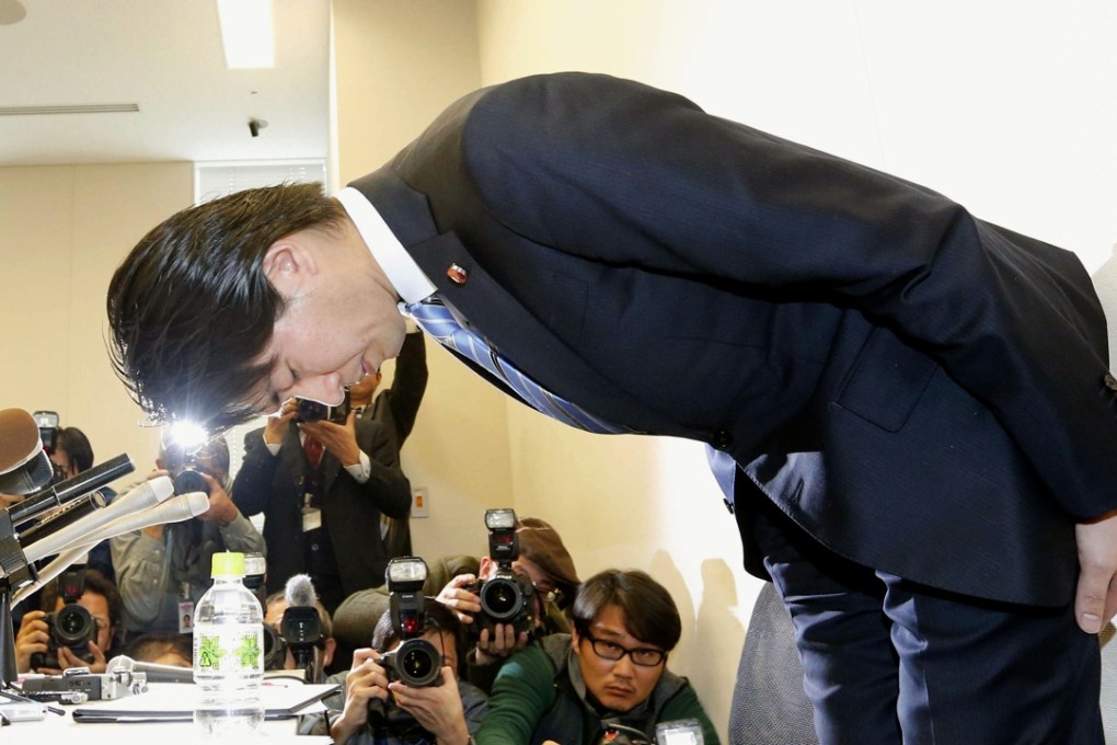 Japanese lawmaker Kensuke Miyazaki of the ruling Liberal Democratic Party, bows during a news conference in Tokyo on Friday after admitting having an affair less than a week before his son’s birth. Photo: Kyodo / AP
