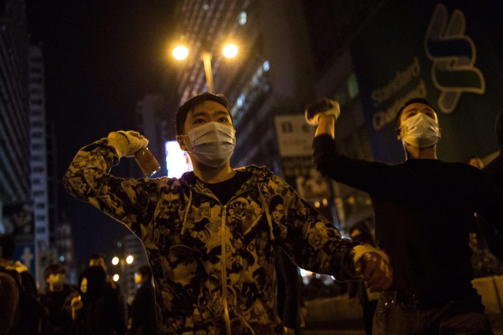 Protesters threw objects at police officers during riots in Mong Kok. Photo: EPA
