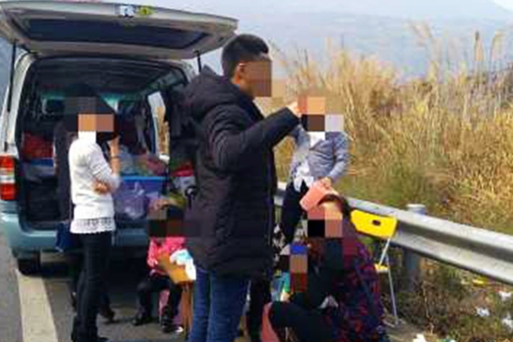 Police spotted a group of Chinese people having a picnic after parking their vehicle on the emergency lane of a highway in Sichuan province. Photo: SCMP Pictures