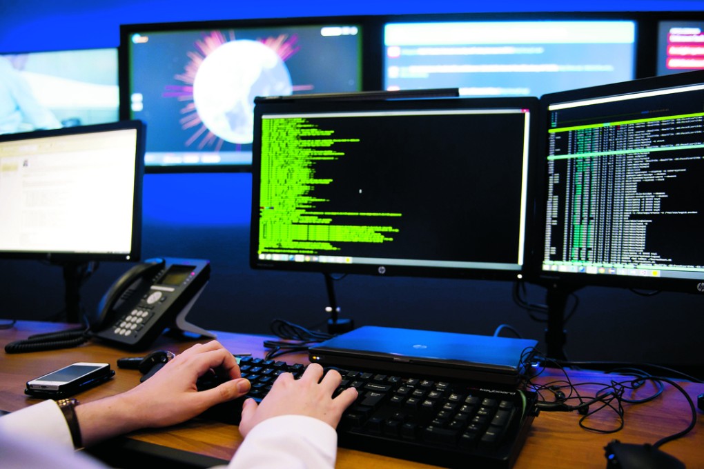Hewlett Packard employees work in the HP cyber defence centre in Boeblingen, Germany, to protect clients from cybercrime. Photo: EPA
