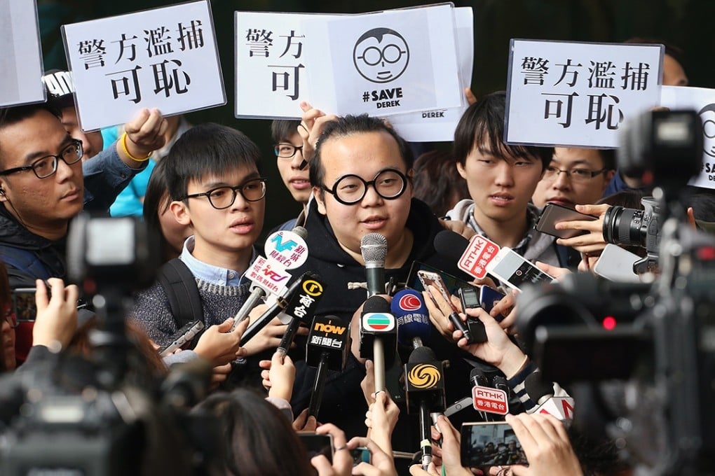 Scholarism's Derek Lam speaks to journalists after appearing in Kowloon City Court. Photo: Felix Wong