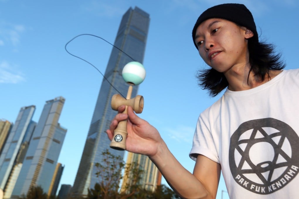 Smore Chan Chung-yin demonstrates his Kendama skills at the West Kowloon Cultural District. Photo: Nora Tam