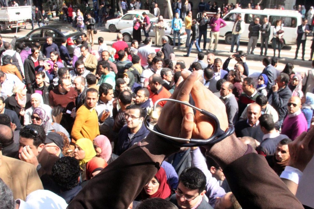 Egyptian doctors shout anti-police slogans at a protest in front of the headquarters of the Egyptian Medical Syndicate in Cairo. Photo: EPA