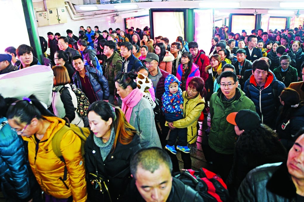 Passengers leave Beijing Railway Station on Friday as the Spring festival came to the end and people started to return to school and work. Photo: Xinhua