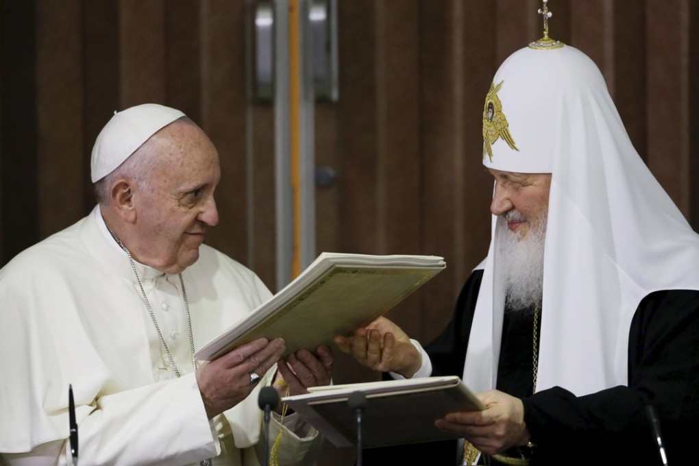 Pope Francis (left) and Russian Orthodox Patriarch Kirill exchange a joint declaration on religious unity in Havana, Cuba on Friday. Photo: Reuters