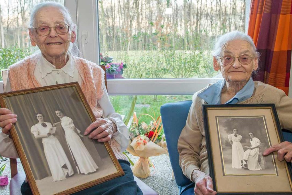 Centenary twins, Paulette Olivier (left) and Simone Thiot. Photo: AFP