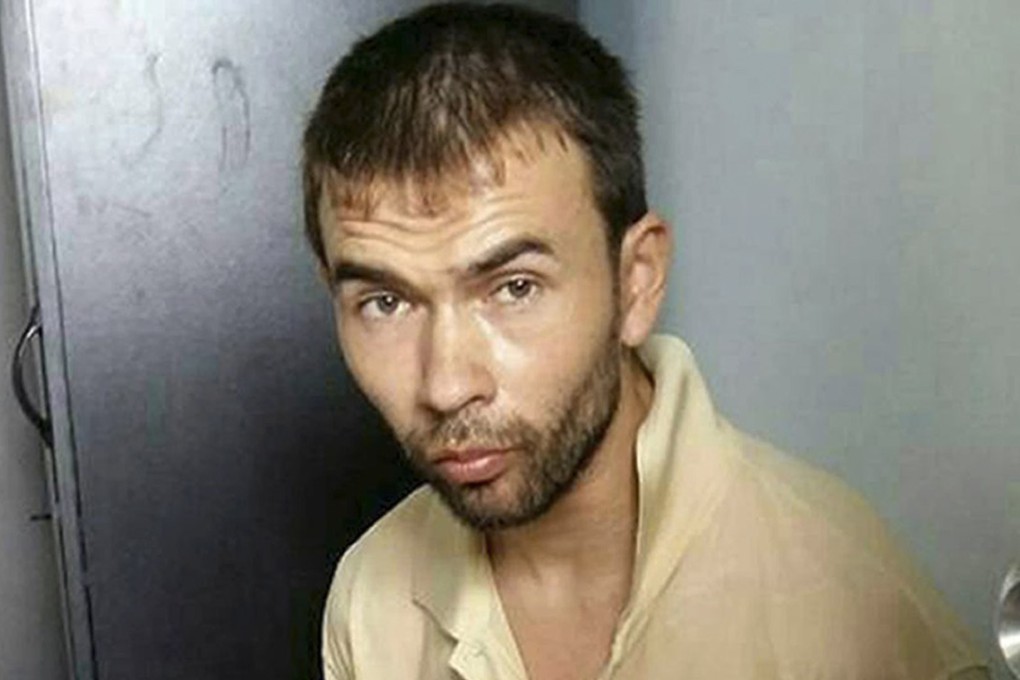 Adem Karadag was arrested by Thai police officers and soldiers at an apartment on the outskirts of Bangkok on August 29 last year, almost two weeks after the deadly blast. Photo: AP