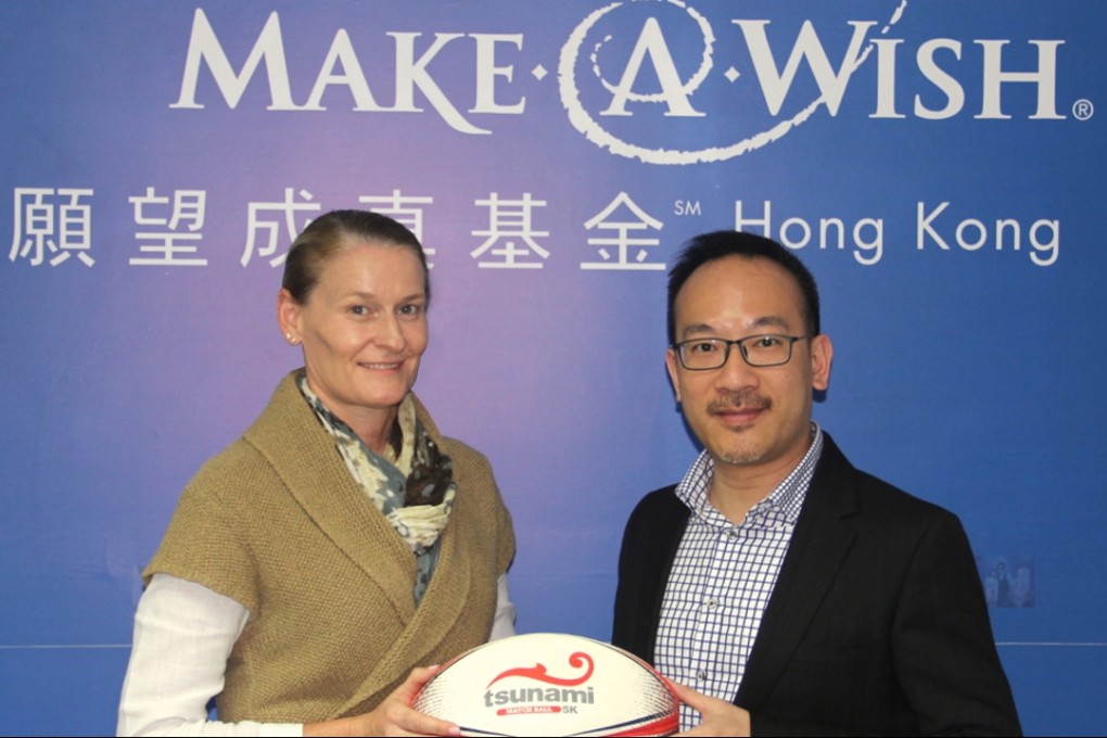 Lisa Foley (left), chairman of the GFI HKFC Tens organising committee, with Kalmond Ma, executive director of Make-A-Wish Hong Kong. Photo: GFI HKFC Tens