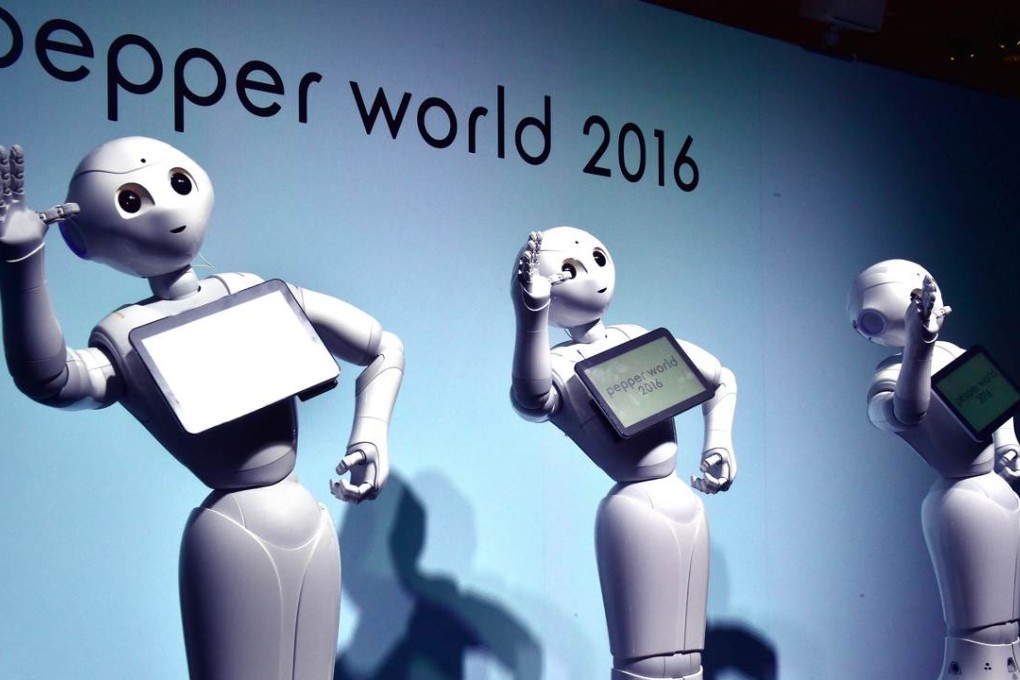 "Pepper", humanoid robots from Japan's telecommunication giant Softbank, dance to attract customers at the "Pepper World" exhibition to promote show applications for corporate use in Tokyo on January 28, 2016. Photo: AFP