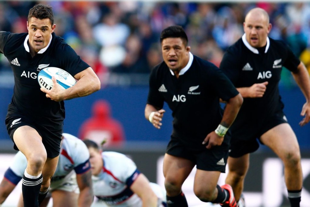 All Blacks legend Dan Carter on the burst with Keven Mealamu in support during New Zealand’s crushing 74-6 win over the USA Eagles at Chicago’s Soldier Field in November 2014. Photo: AFP