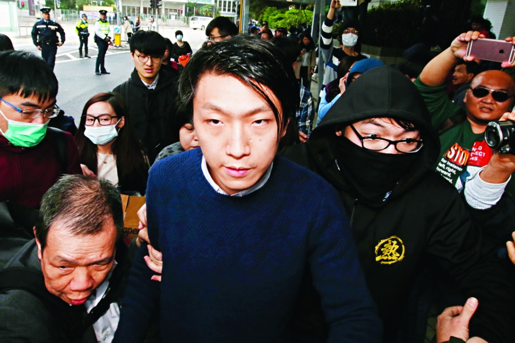 Edward Leung Tin-kei is leaves Kowloon City Court after charged with rioting in connection with the Mong Kok clashes. Photo: Edward Wong