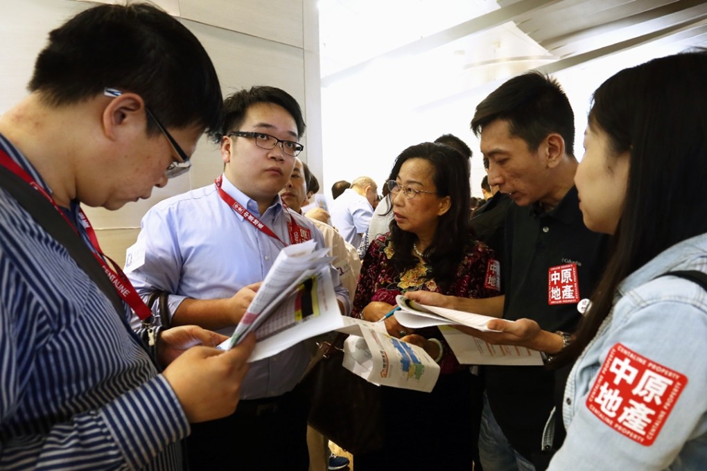 Property agents gathering at a land sale in Central in October last year. Photo: Jonathan Wong