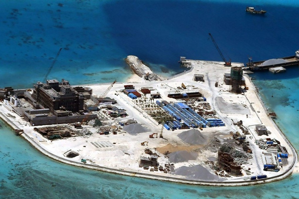 Aerial view of construction at Mabini (Johnson) Reef by China, in the disputed Spratley Islands, in the south China Sea. China deployed two batteries of sophisticated surface-to-air missile launchers to a disputed island in the South China Sea yesterday. Photo: EPA