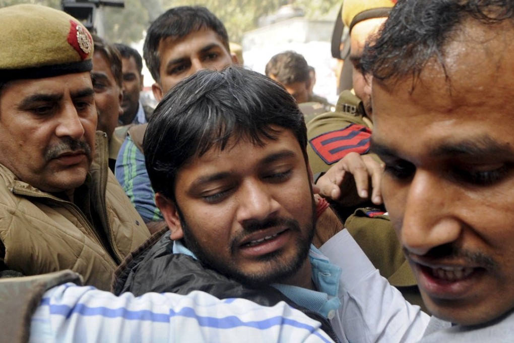 Kanhaiya Kumar (centre), head of the student union at Delhi's Jawaharlal Nehru University (JNU), is escorted by police outside the Patiala House court in New Delhi, India. Photo: Reuters