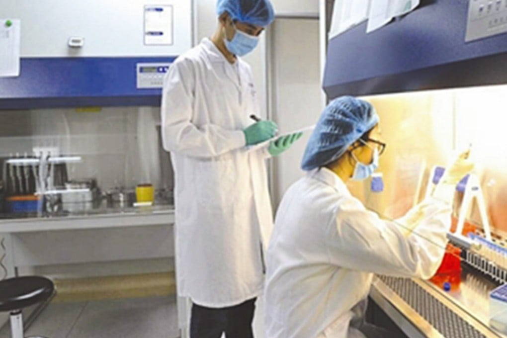 An employee examines DNA samples at a forensic testing centre in Sichuan province. Photo: SCMP Pictures