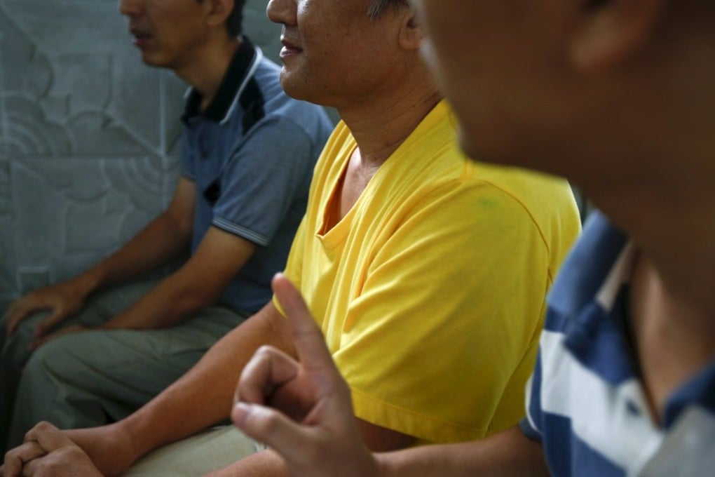 Chinese dissidents, who asked not to be identified, speak during an interview in Bangkok. Photo: Reuters